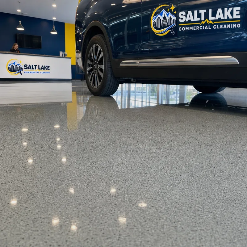 Uniform glossy showroom floor finish without visible scuffs or mop marks near a vehicle display